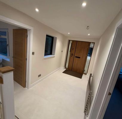 Entrance hallway with an oak front door and tiled floor